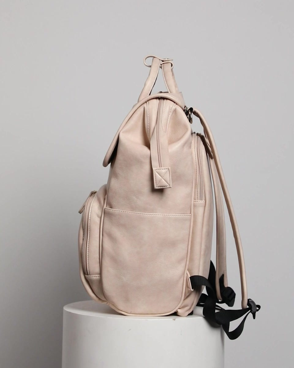 Commuter 23 backpack in taupe, side view with the side pocket, for parents on the commute