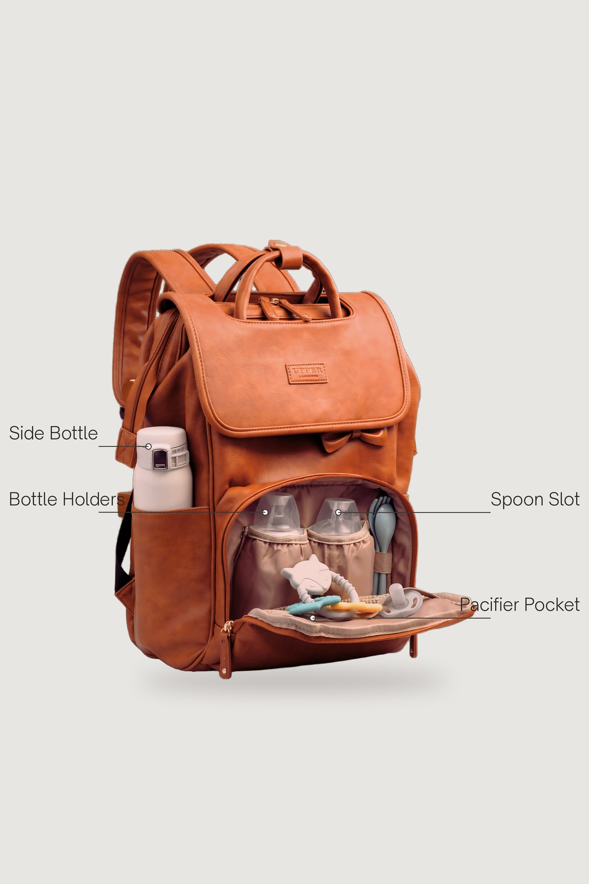 DayFlow 23 parent commuter backpack front pockets, labeled for bottles and quick-grab essentials