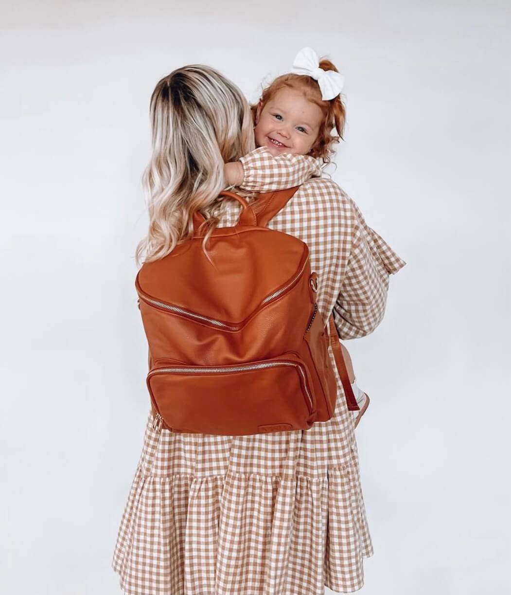 Harvey everyday backpack worn by a mom carrying her child