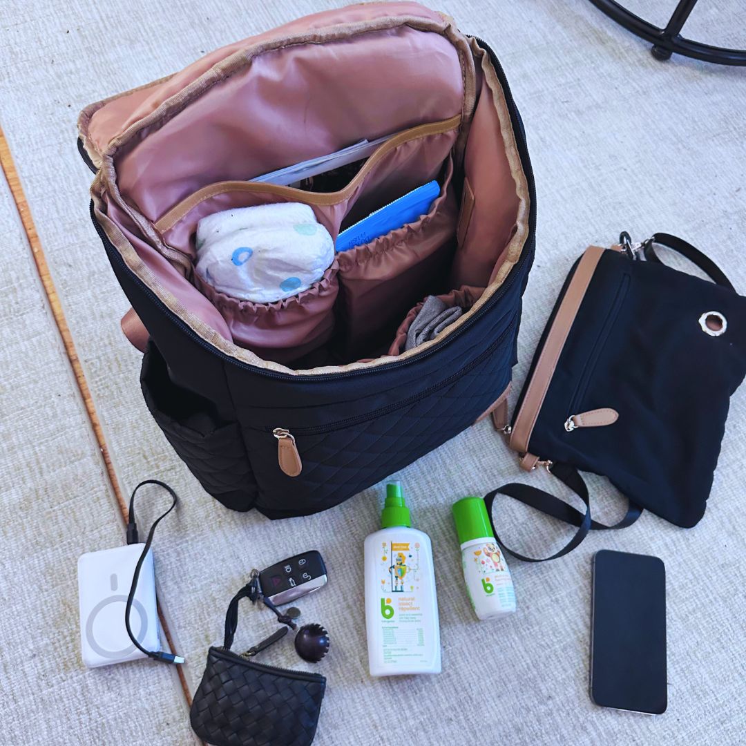 Maison Air open with baby essentials and the crossbody sling