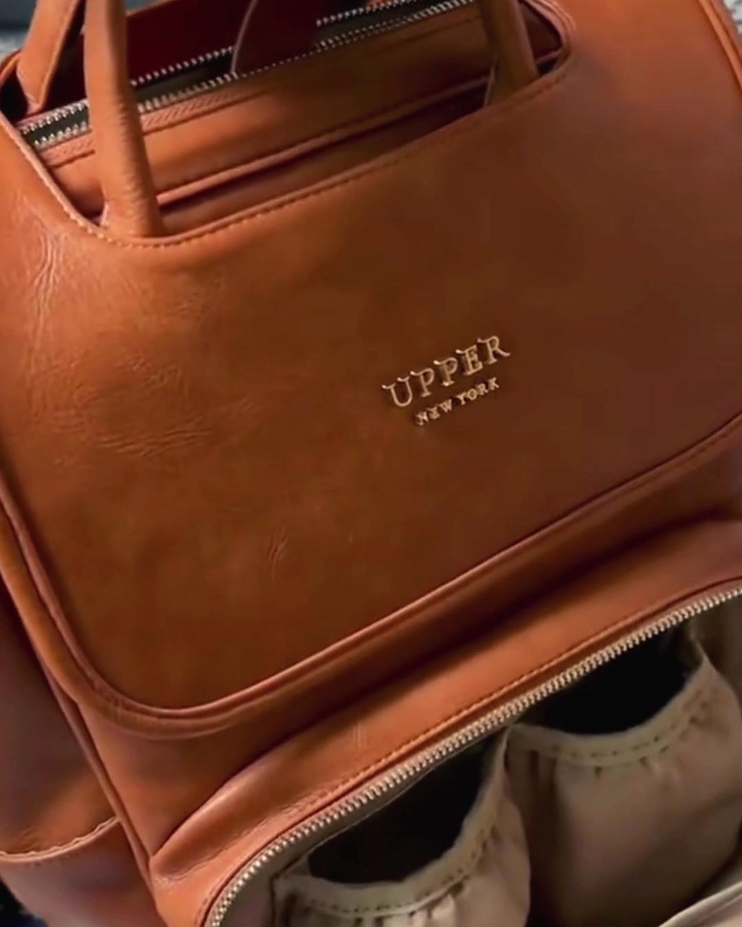 DayFlow everyday backpack in caramel, close-up of the front pockets holding bottles